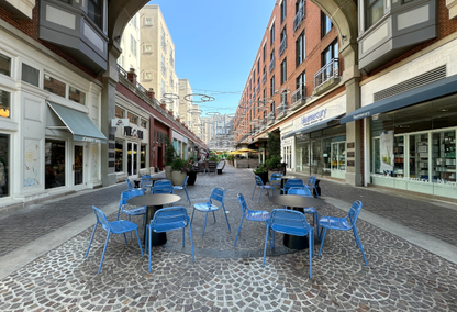 blue chairs in patio arrangement in street plaza